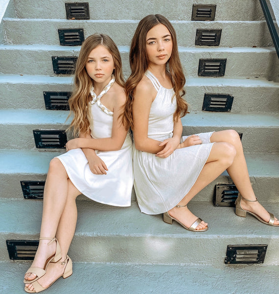 Gracie and Lilly wearing the Olivia White and the Ariana Silver! Both on sale now!